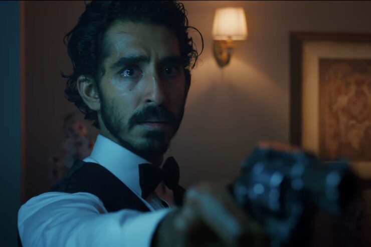 Dev Patel in Monkey Man, holding a pistol