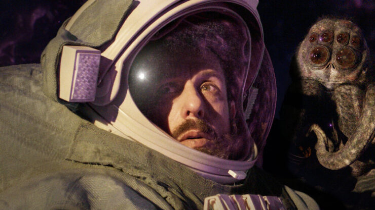 A scene from Spaceman (2024): astronaut Jakub (Adam Sandler) and the alien-spider Hanus