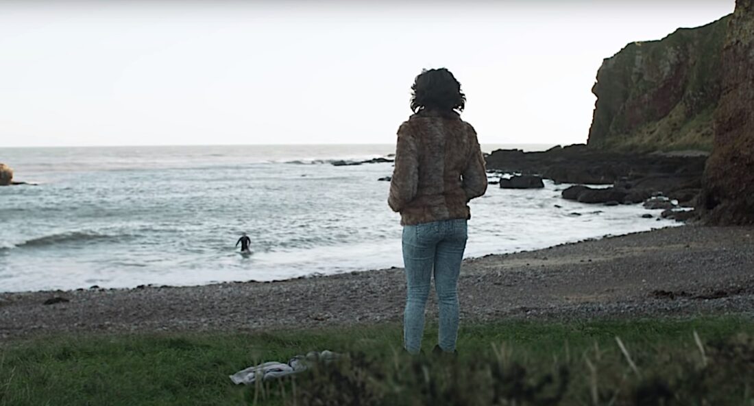 Scarlett Johansson's alien observes a swimming man in Jonathan Glazer's Under the Skin