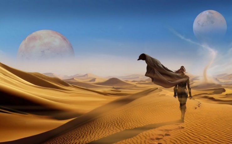 Art from the book cover of The Winds of Dune: a figure walks away from the viewer through a vast desert. A dust devil rises in the distance, and two moons or other celestial bodies are visible in the sky.